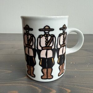 Vintage RCMP ceramic mug designed by Canadian artist Marc Tetro